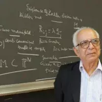 M.S. Narasimhan in front of a chalk board